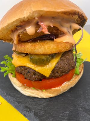 Fully Loaded: 5” vrioche, mayo, lettuce, tomato, Dirty Vurger patty, cheeze, pickles, hash brown, onion ring, coleslaw and in-house burger sauce at Dirty Vurgerz in London