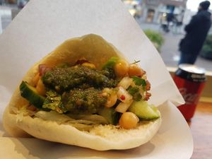 pita bread with oyster mushrooms and sauce and veg from counter  at Maoz - Muntplein in Amsterdam