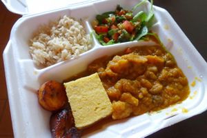 Cucumber stoba, brown rice, house salad and fried plantain. at The Magic Mushroom Kitchen in Oranjestad