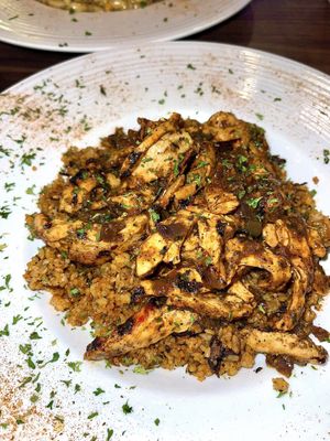 vegan jerk chick’n with mushroom rice   at J's International Grill in Richardson