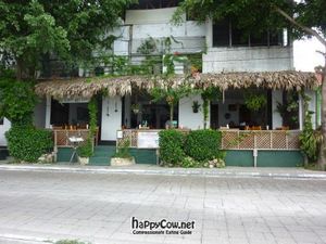 Tables facing the lake, and amazing sunset at La Villa Del Chef in Flores