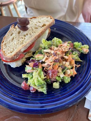 Chickpea sandwich with broccoli carrot salad in homemade plant based ranch.  at Green Leaf Plant Based Bistro in Corozal