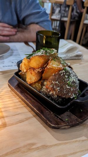Crispy Potatoes with vegan parmesan at Vine & Olive in Titusville