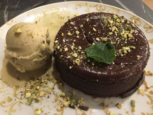 Chocolate cake with pistachio ice cream   at Giulietta - Pizzeria & Cucina Vegana in Lisbon