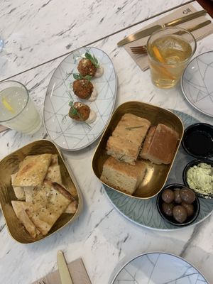 Garlic bread, arancini and foccacia   at Giulietta - Pizzeria & Cucina Vegana in Lisbon