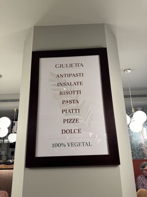 A sign   at Giulietta - Pizzeria & Cucina Vegana in Lisbon