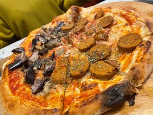 Two option pizza (combination of two menu pizzas, each side is one) at Giulietta - Pizzeria & Cucina Vegana in Lisbon