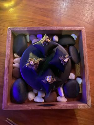 Black pita parcels  at TABŪ in Dubai