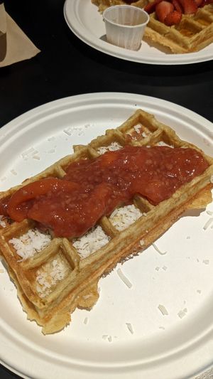 Homemade seasonal compote and coconut flakes at Waffle Frolic in Ithaca