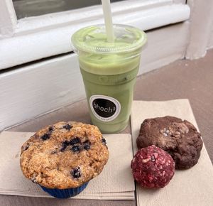 Blueberry muffin, chocolate cookie, energy ball & cold matcha latte with oat milk  at Coffee + Matcha Bar in Basel