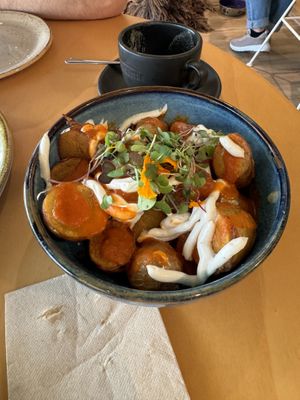 This place was very cozy and bright, a lot of natural light coming in. They had great options for hot drinks and food. We got the patatas bravas and mushroom pinsa .  at Alubia plant power in Mallorca