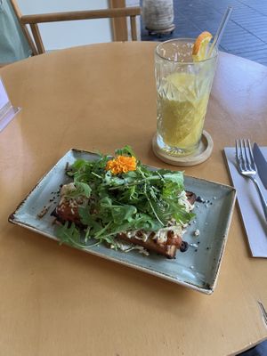 Mushroom, “cheese” and rocket waffle, with freshly pressed orange juice    at Alubia plant power in Mallorca