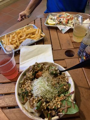 Buddha bowl, gyro, kombuchas, & (free!) fries.  Great food, generous portions, very nice staff.  And freebies for next visit.  Very happy to have a fully vegan tasty restaurant !  at Earth Aloha Eats in Kihei