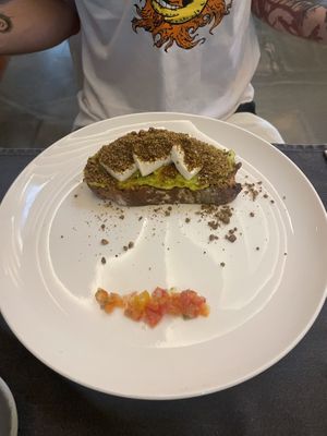 Avocado toast with dukka  at Jaya House River Park in Siem Reap