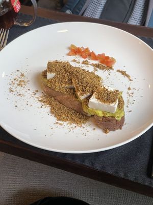 Smashed avocado with silk tofu and pistachio dukkah  at Jaya House River Park in Siem Reap