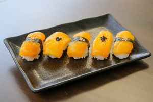 Citrine Nigiri - A small delicious treat that features a sliced roasted and seasoned bell pepper, laid over a cluster of sweet and salty vinegared rice. at ARITO - Japanese Vegetarian Fusion in Bangkok
