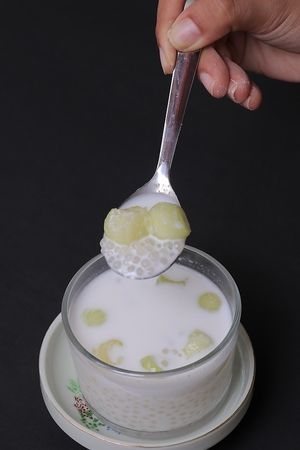 Saku Kathi - A traditional Thai dessert with a twist. Tapioca Pearls with Coconut milk, topped with melon, served chilled at ARITO - Japanese Vegetarian Fusion in Bangkok