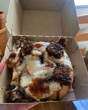 Customized cinnamon roll with maple icing, banana bread chunks, bananas, and chocolate sauce   at Cinnaholic in Marlton