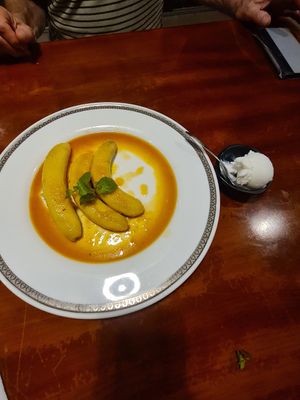 Banana cooked in a rum style sauce with coconut icecream at Hoang's Restaurant Vietnamese Cuisine in Hanoi