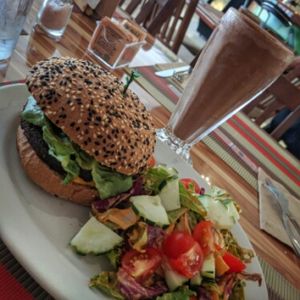 Burger with salad and chocolate malteada at Vegan Planet in Cancun