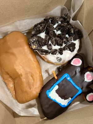 Clockwise from left, all vegan: Maple bar, Dirt, Voodoo Doll   at Voodoo Doughnuts in San Antonio