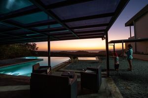 Pool view at night at Segunda Vida Inn in San Juan Del Sur