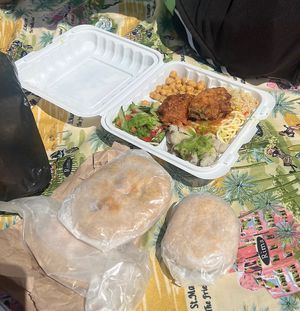 In the white container is the royal feast which we got because we saw someone else eating it at a table. Didn’t disappoint!!   at Beyond Vegan in Castries City