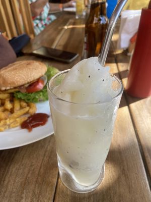 Pineapple smoothie that comes with burger   at Hostal Azul in Granada