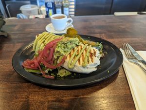 Sweet potato burrito with house raspberry vinaigrette on the garnish that makes it explode. at Highlander Café in Lawrence