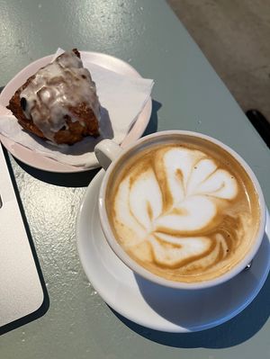 Almond milk latte paired with a vegan cranberry orange scone. Yummy!  at Guilder Coffee Company - Fremont in Portland