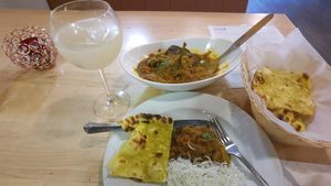 eggplant shank, garlic naan and cardamom dreams. at Maurya's.Rest.Bar.Banquet in Kamloops