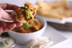 Dreaming of this beautiful bite: Refreshing chickpeas, gravy so flavorful, & wrapped like a present with fluffed to crisp BANNOCK-like bread. at Maurya's.Rest.Bar.Banquet in Kamloops