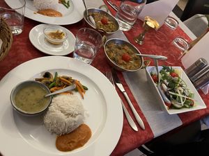 From left to right: Lentil soup, veg, tomato sauce. Bean stew, marinated aubergine stew. (Epic consistency on the aubergine; I loved it). Side salad.  at Himalaya Kök och Bar in Gothenburg