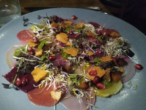 Multi coloured beet carpaccio with homemade tofu bacon at Linde Restaurant in Heidelberg