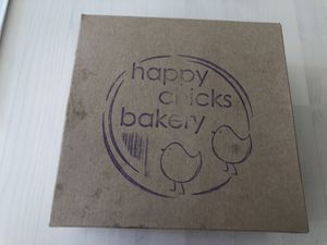 Carry-out container for pudla at Happy Chicks Bakery in Cincinnati