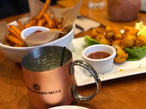 Sweet potato fries and buffalo cauliflower bites  at Sweet Grass Grill in Tarrytown