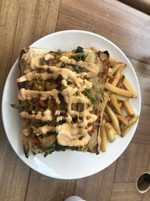 Vegan Philly cheese steak with fries  at Sweet Grass Grill in Tarrytown