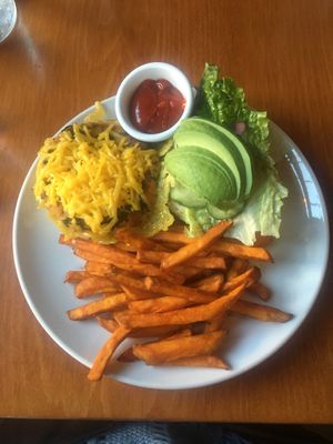 Quinoa Sweet Potato Kale Burger with Vegan Cheese and some Sweet Potato Fries! at Sweet Grass Grill in Tarrytown