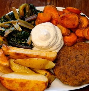 Burger with potatoes at ZEM Bistro in Bologna