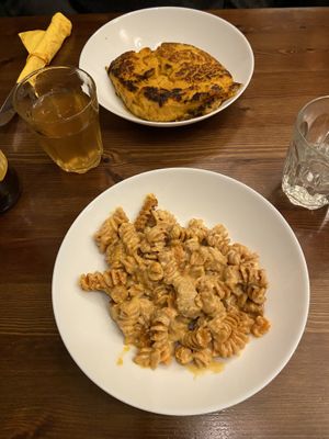 Oven-baked pasta (and pumpkin lasagna at the back)  at ZEM Bistro in Bologna