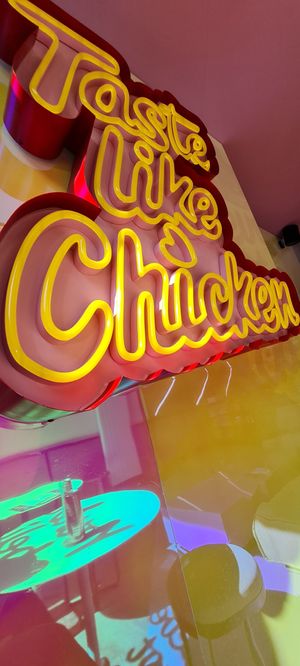 Signage inside at Taste Like Chicken TLC in Amsterdam