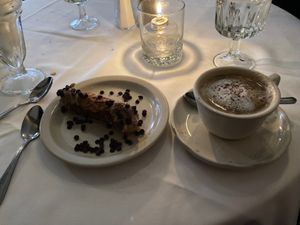 Vegan cannolo and cappuccino with coconut mylk. at John's of 12th Street in New York City