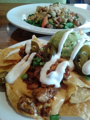 today's lunch: loaded nachos and Bombay curry bowl. So awesome at Veggie Grill by Next Level in Long Beach