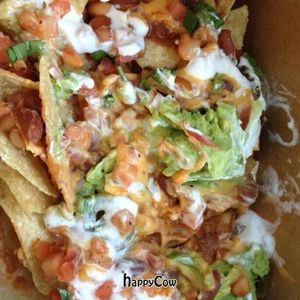 Vegan Nachos to go. at Veggie Grill by Next Level in Long Beach