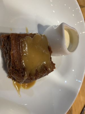 Date pudding with vegan cream  at Geshmak in Caerphilly