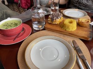 Macha latte with those yummy sweets   at A Padoca in Porto