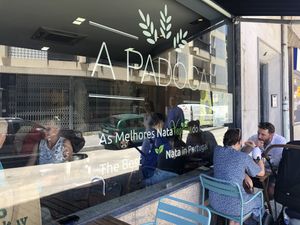 Couple of outdoor tables  at A Padoca in Porto