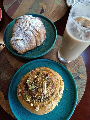 Almond croissant & pistachio cinnamon bun at A Padoca in Porto