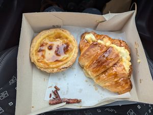 Nata tart and salted caramel croissant at A Padoca in Porto