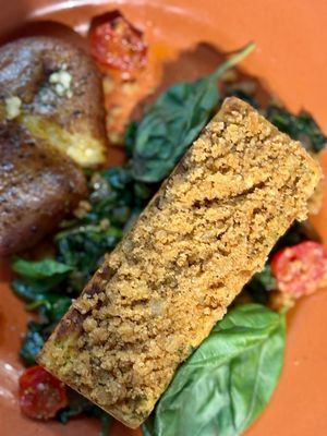 "Discover the vegan twist on Bacalhau com Broa, a classic of Portuguese cuisine reinvented for everyone to enjoy!" at A Padoca in Porto